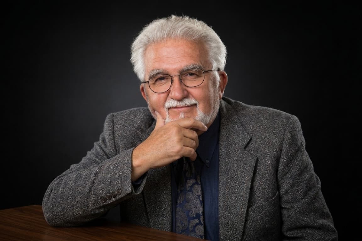 Portrait of Ed Stauffer, chin resting on his hand